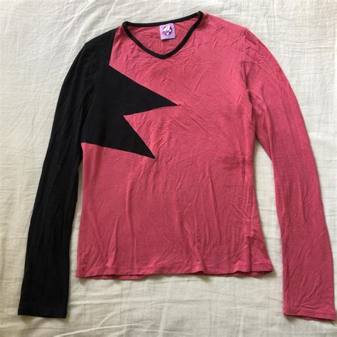 Pink and black long sleeve top with a star design on... - Depop
