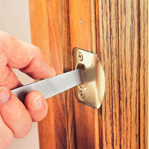 How To Adjust the Strike Plate On a Door That Won't Latch | Family Handyman