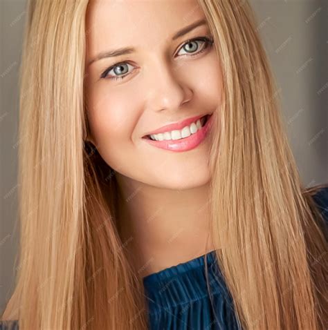 Premium Photo | Beauty and femininity beautiful blonde woman with long blond hair smiling ...