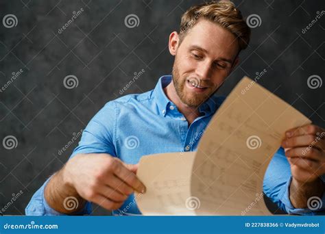 The Portrait of the Man Reading Paper at the Table in the Studio Stock ...