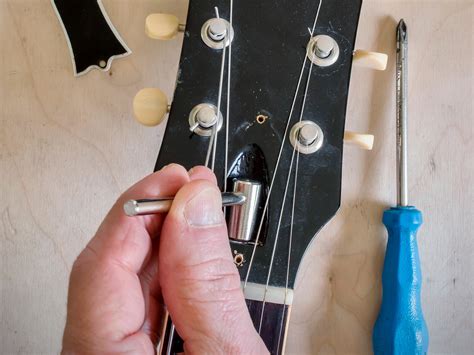 How To Adjust Truss Rod On Electric Guitar | Detroit Chinatown