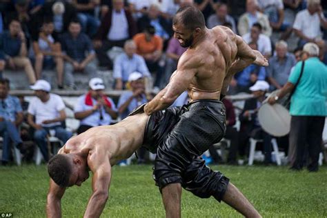 Greek wrestlers in olive oil put hands' down rivals' trousers to win ...