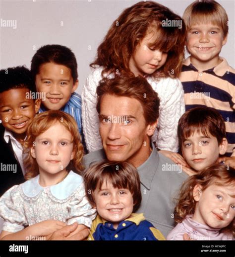 KINDERGARTEN COP, Arnold Schwarzenegger (center), Joseph/Christian ...