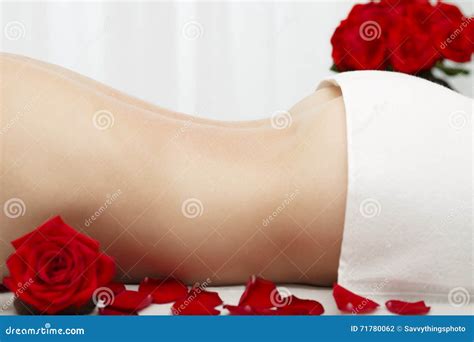 Young Woman Receiving Swedish Deep Tissue Massage Red Roses Stock Photo ...