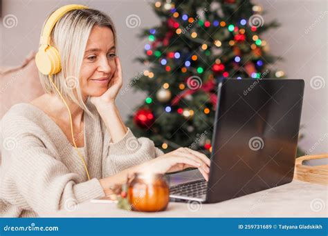 Adult Woman in Cozy White Knitted Sweater Using Laptop in Living Room ...