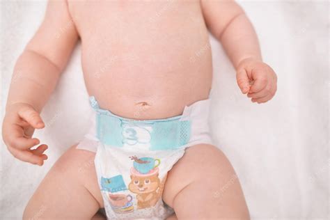 Premium Photo | The babys navel in the diaper healthy stomach a cure ...