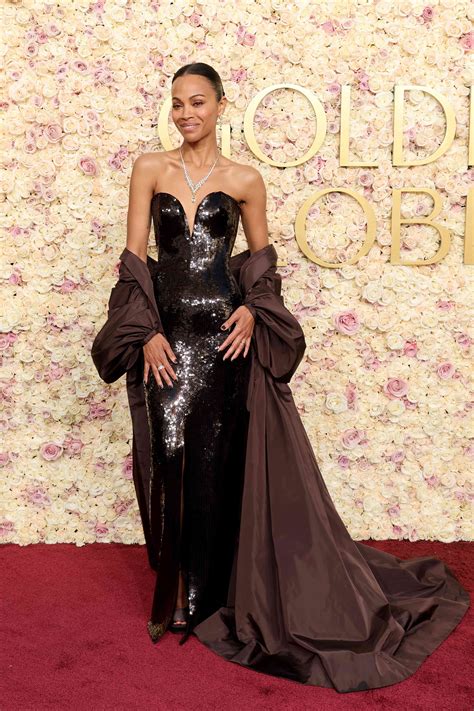 Zoe Saldaña Steps Out in the Color of the Season for 2025 Golden Globes ...