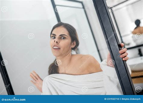 A Young Gril Looking Silly Pressing Her Face To the Glass Stock Photo ...