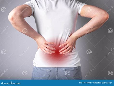 Backache. Woman Suffering from Lower Back Pain with Red Point Closeup Stock Photo - Image of ...