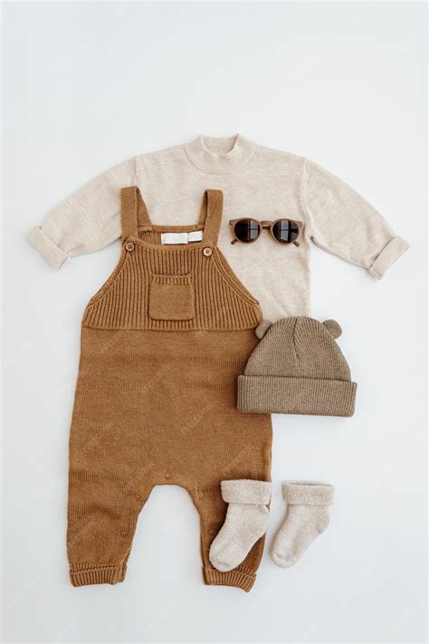 Premium Photo | Cute gender neutral baby clothes Knitted jumpsuit ...