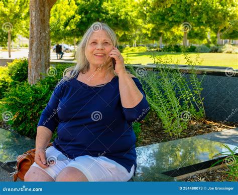 Mature White Woman Talking on Her Cellphone Stock Image - Image of beautiful, portrait: 254480073