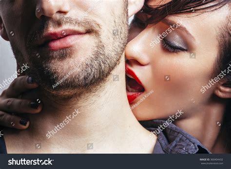 Woman Kissing A Man On The Neck Stock Photo 360404432 : Shutterstock