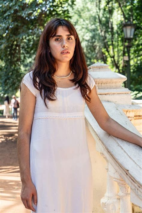Young Latin Woman Posing in White Dress in Park Stock Image - Image of ...