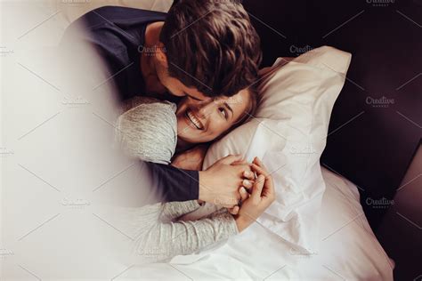 Romantic couple in love lying on bed | High-Quality People Images ...