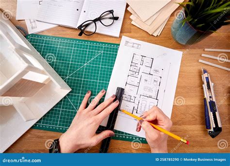 POV Shot of Female Architect Working in Office Measuring Plans for New Building Stock Photo ...