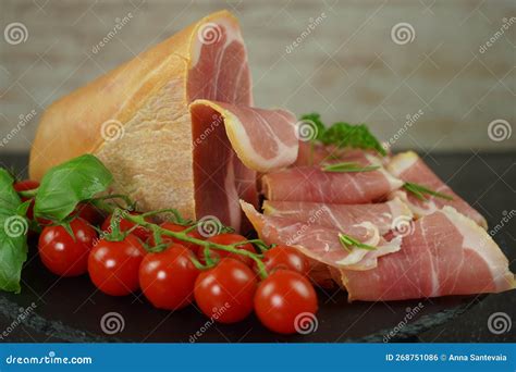 Traditional Italian Smoked Dry Ham Close-up Composition with Basil and ...