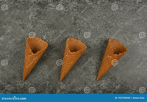 Three Empty Wafer Ice Cream Cones on Gray Table Stock Photo - Image of ...