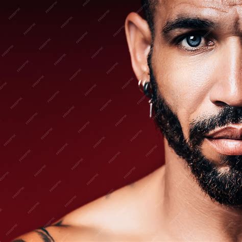 Premium Photo | Handsome blueeyed cuban or latino with beard looks ...