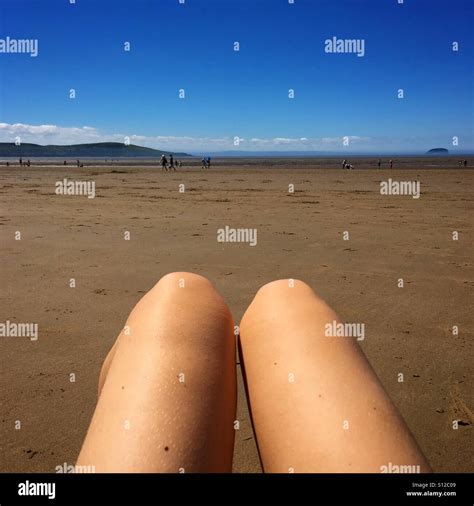 Hot dog legs beach hi-res stock photography and images - Alamy