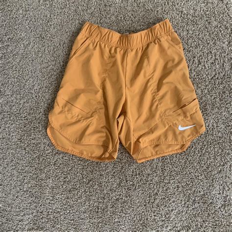 Orange Nike shorts - Depop