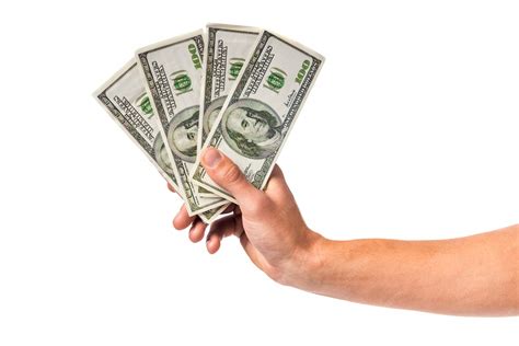 Premium Photo | Male hand holding money cash