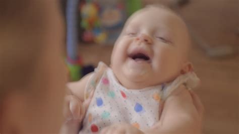 Mother playing with her newborn giggling daughter 28719337 Stock Video ...