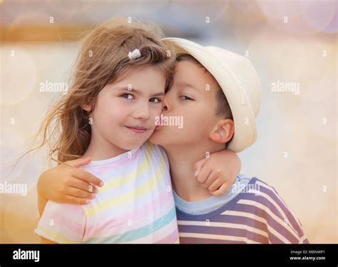 Girl kissing boy hi-res stock photography and images - Alamy