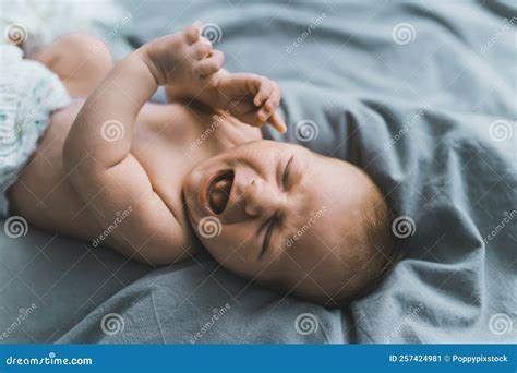 Naked Infant Baby Boy Screaming and Crying in His Sleep while Laying on ...