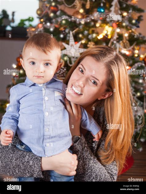 Baby boy and mommy, Christmas portrait Stock Photo - Alamy