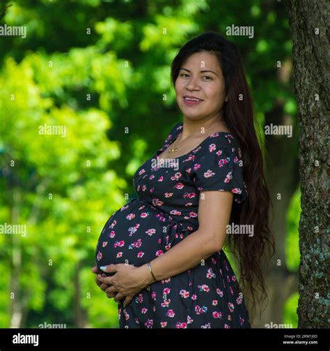 Mexican mother posing for a maternity photoshoot Stock Photo - Alamy