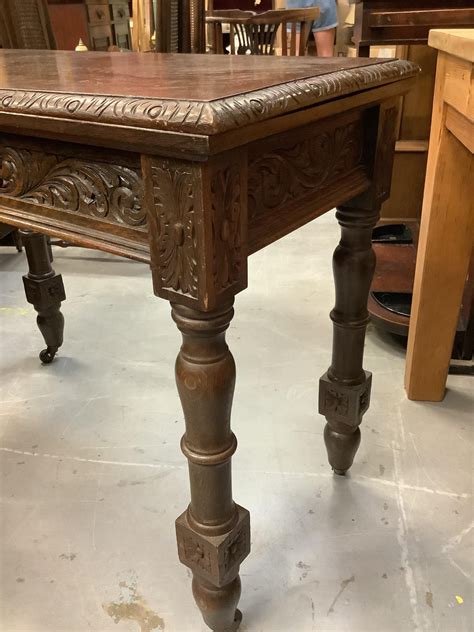 Lot 887 - Edwardian oak rectangular card table with