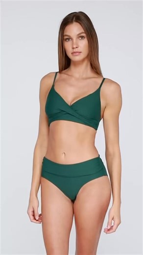Meet your new favorite bralette – and everyone else’s too! Available now in this beautiful deep green as well as other solids and prints! With its sexy crossover style, V neckline, and adjustable string ties, it gives you sleek coverage and a flawless fit. The removable cups and wire-free support make it as comfy as it is flattering. . . . #NewDrop #BraletteLove #StyleAndSupport #swimwearGoals #WireFreeWonder #CurvesInStyle #MustHaveTop #ComfortMeetsChic | Southeast Swimwear