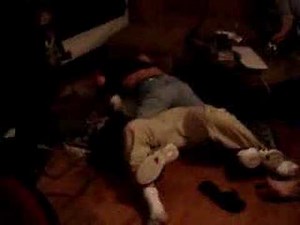 strange wrestling - 2 guys squeezing each other nuts