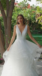 This fairytale princess wedding dress features a tailored soft crepe bodice with a dreamy tiered ruffle skirt. #AdrianaAlier Discover the style: https://bit.ly/3G4C4p8 #租婚紗 | DBR Weddings | Facebook