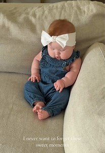Baby girl with Down syndrome smiling—sweet moments captured
