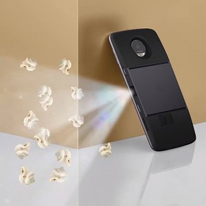 With the projector mod, it’s always popcorn time! #MotoMods #MotoZ #hellomoto | Motorola