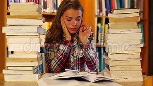 Stressed Student Studying and Taking Notes in the Library Surrounded by Books Stock Video - Video of person, female: 40118969