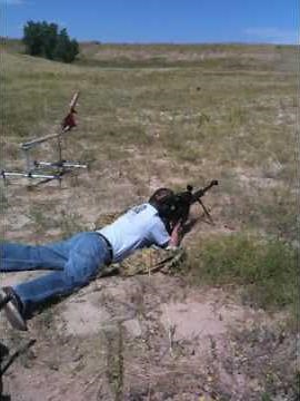 Fat Guy shooting a big gun