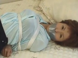 japanese girl tape gagged in skirt and blouse