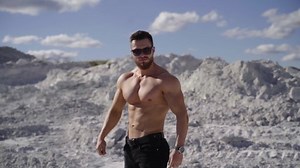 clip-1061129242-muscular-man-posing-outdoors-handsome-shirtless-hunk