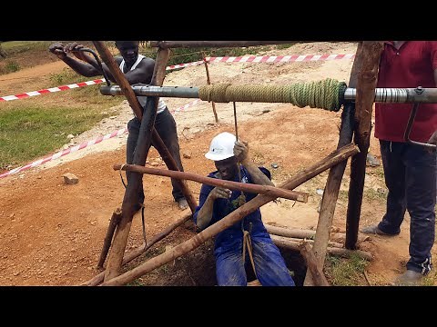 How to dig a shallow water well using manual labor - Digging a hand dug water well