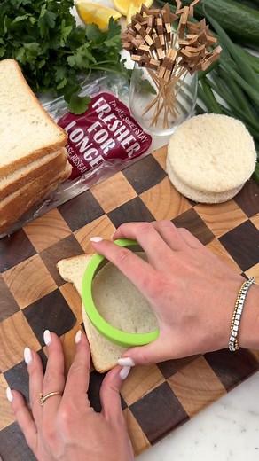 CHRISTMAS CHICKEN SANDWICHES 🎄 Using Bakers Delight white block loaf! Ingredients: 1 loaf Bakers Delight White Block 1 roast chicken 1/4 cup chopped spring onions 1/4 cup finely chopped celery 2 tbsp light sour cream 2 tbsp mayonnaise 1 tsp dijon mustard 1 tbsp chopped dill 1 tbsp chopped parsley 1 tsp salt 1 tbsp cracked pepper 1/2 lemon juice 2 tbsp softened butter 1 large cucumber Skewers Method: 1. Pull the chicken off the bones, keeping some of the juicy skin (not the hard bits) and 1 tsp