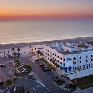 Our front door? Steps from the shore. Seaside Amelia Inn: where beach days begin with a breeze. #SeasideWelcome #BeachfrontVibes #TravelAmeliaIsland #OceanStepsAway | Seaside Amelia Inn