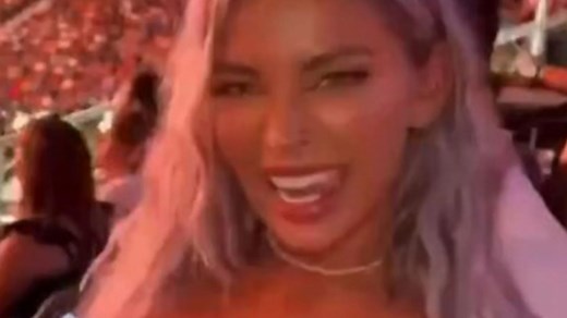 Moment model repeatedly flashes boobs in crowd at UFC before she's kicked out