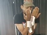 Video: Money launderer seen flaunting and kissing wads of cash | Daily Mail Online