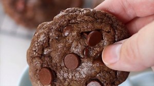2.1K views · 37 reactions | Chewy and loaded with chocolate, these double chocolate chip cookies are heavenly! Is it a cookie or a brownie in cookie form? You choose. RECIPE: https://gluesticksblog.com/favorite-double-chocolate-chip-cookies/ | Gluesticks | Facebook
