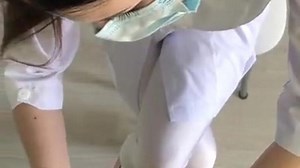 Female doctor examines penis