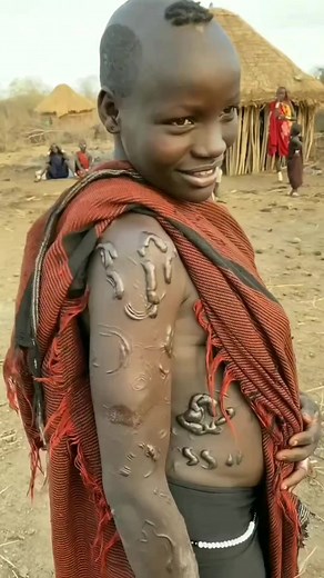 Elaborate Skin Scarification of a Young Bodi Tribe Woman in Omo Valley, Ethiopia