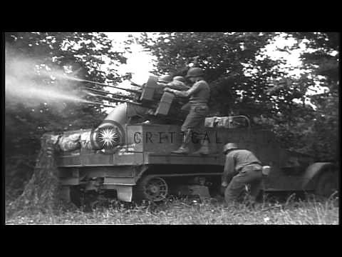 A soldier loads and fires a multiple 50 caliber machine gun on an M-16 motor carr...HD Stock Footage