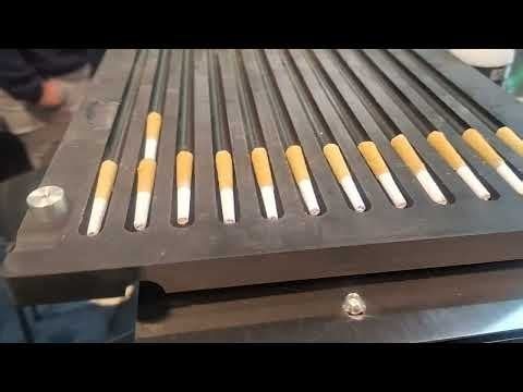 We just built a machine to automation the "kief coating" or cannabis pre-rolls. First run! Capable of 2,800 per hour (humans make about 150 per day by hand).